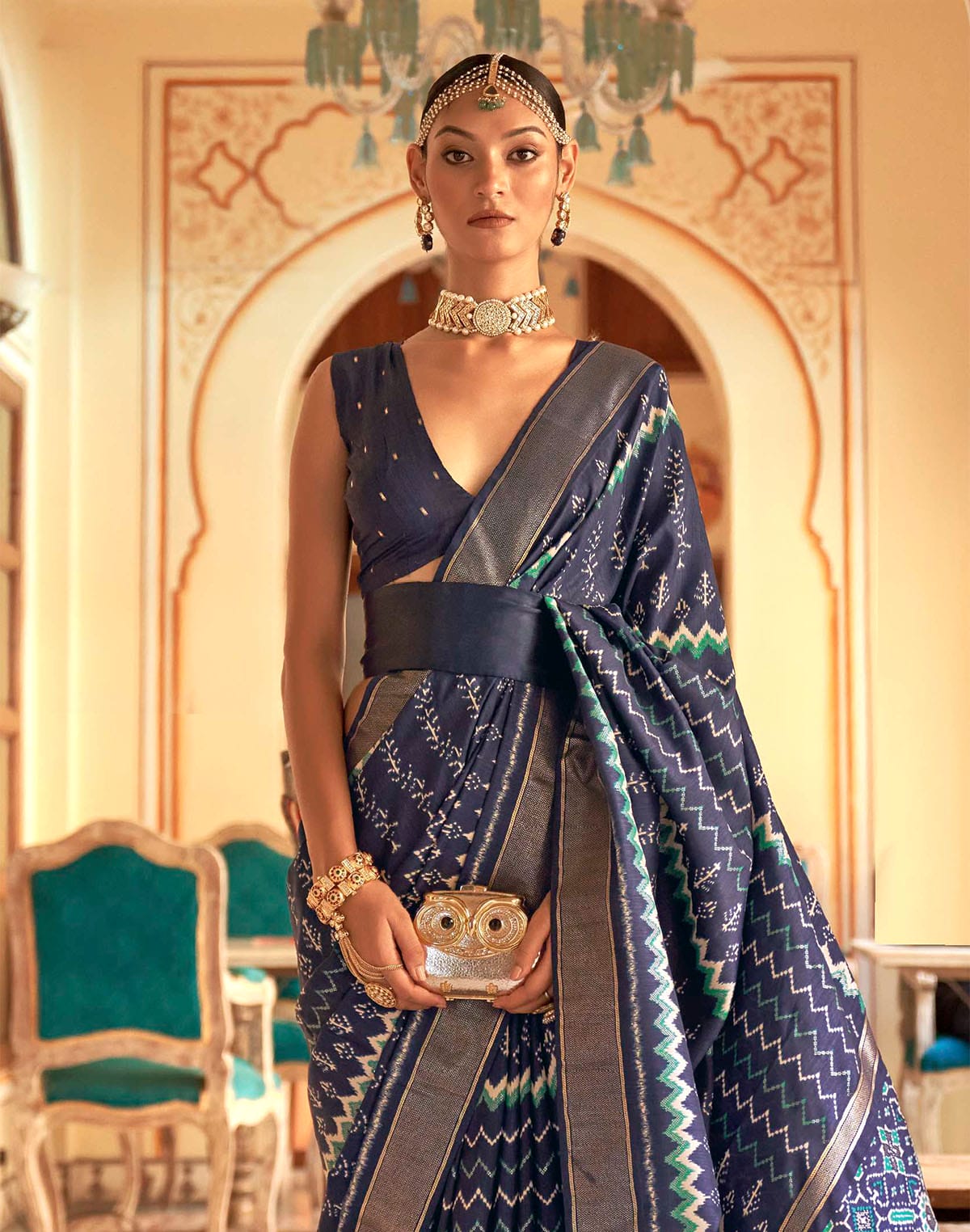 Collection of Navy Blue Ikat Print Patola Designer Saree in a gallery layout