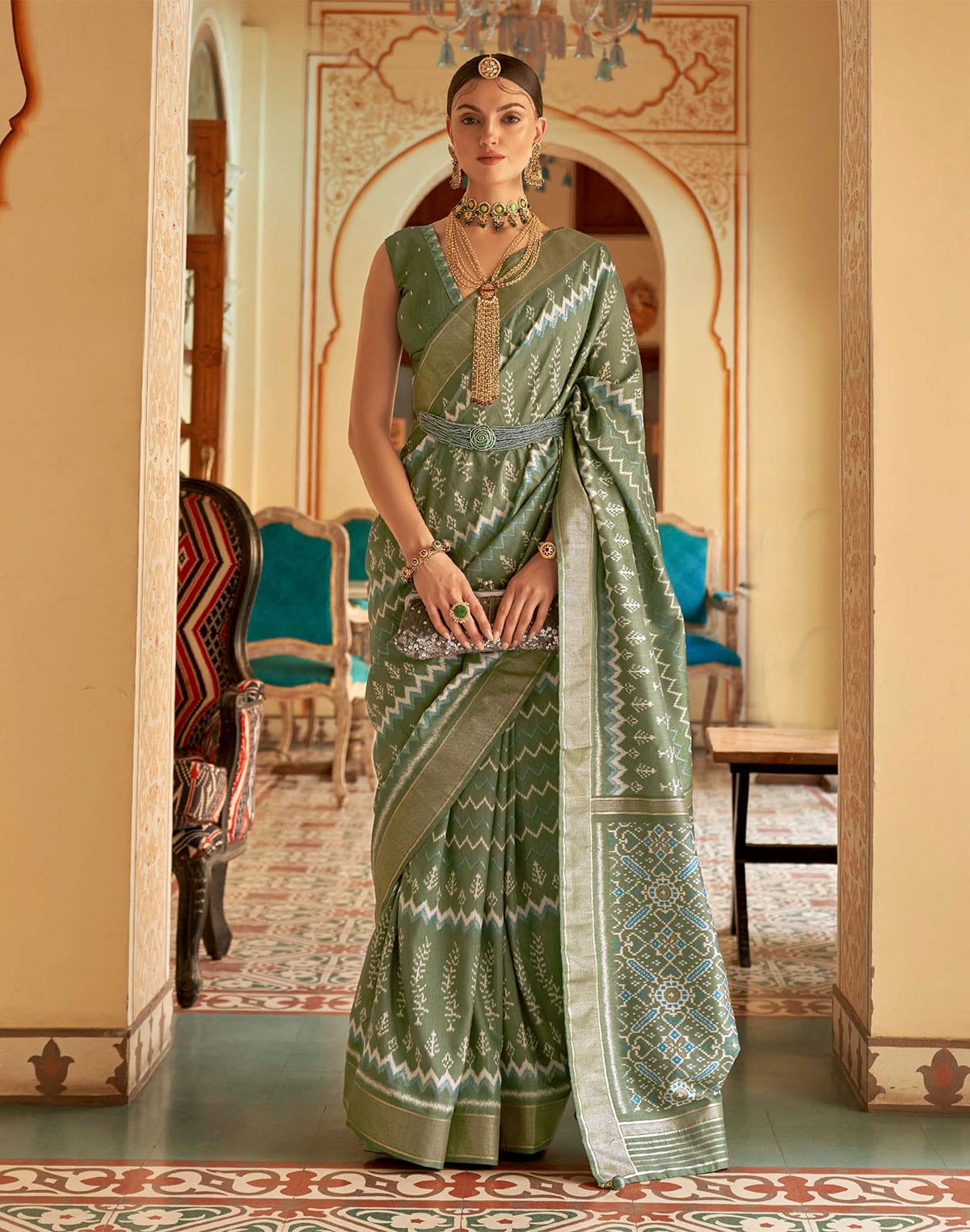 Collection of Olive Green Ikat Print Patola Silk Saree in a gallery layout