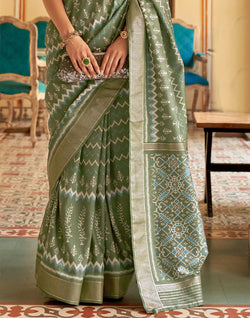 Collection of Olive Green Ikat Print Patola Silk Saree in a gallery layout