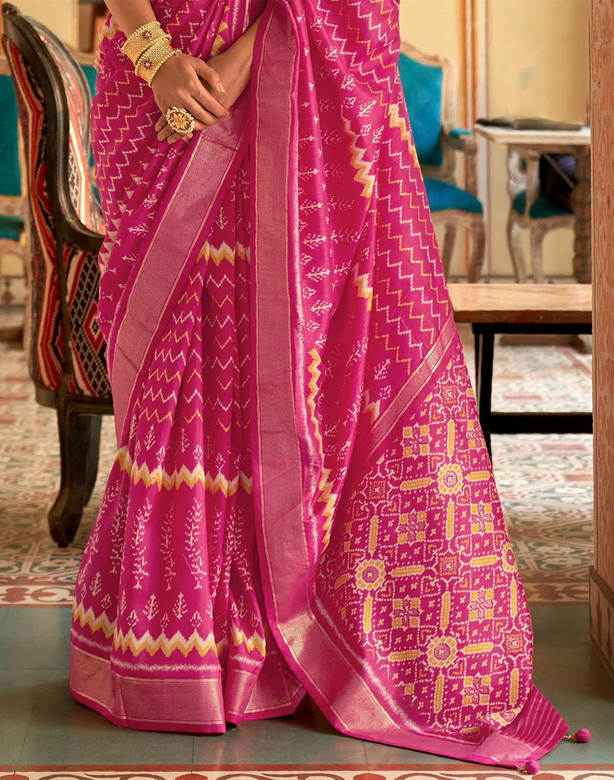 Collection of Dazzling Magenta Patola Silk Saree in a gallery layout