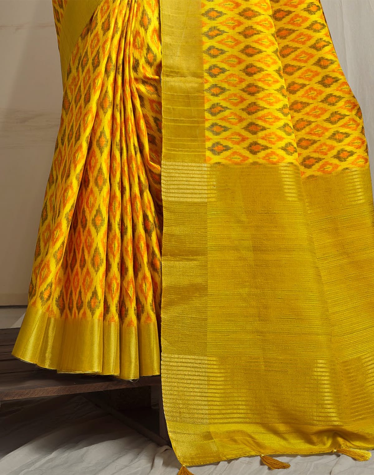 Collection of Yellow Tussar Silk Ikat Printed Saree in a gallery layout