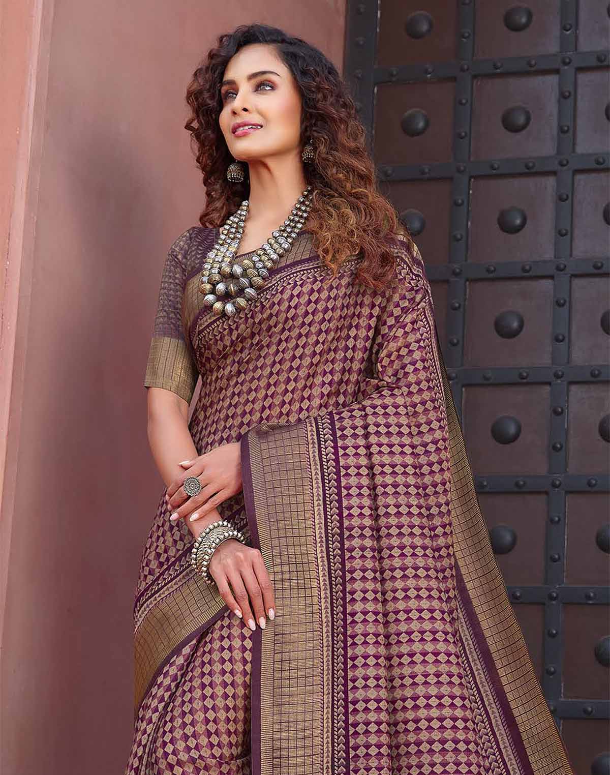 Collection of Wine Coloured Jute Silk Fancy Saree in a gallery layout