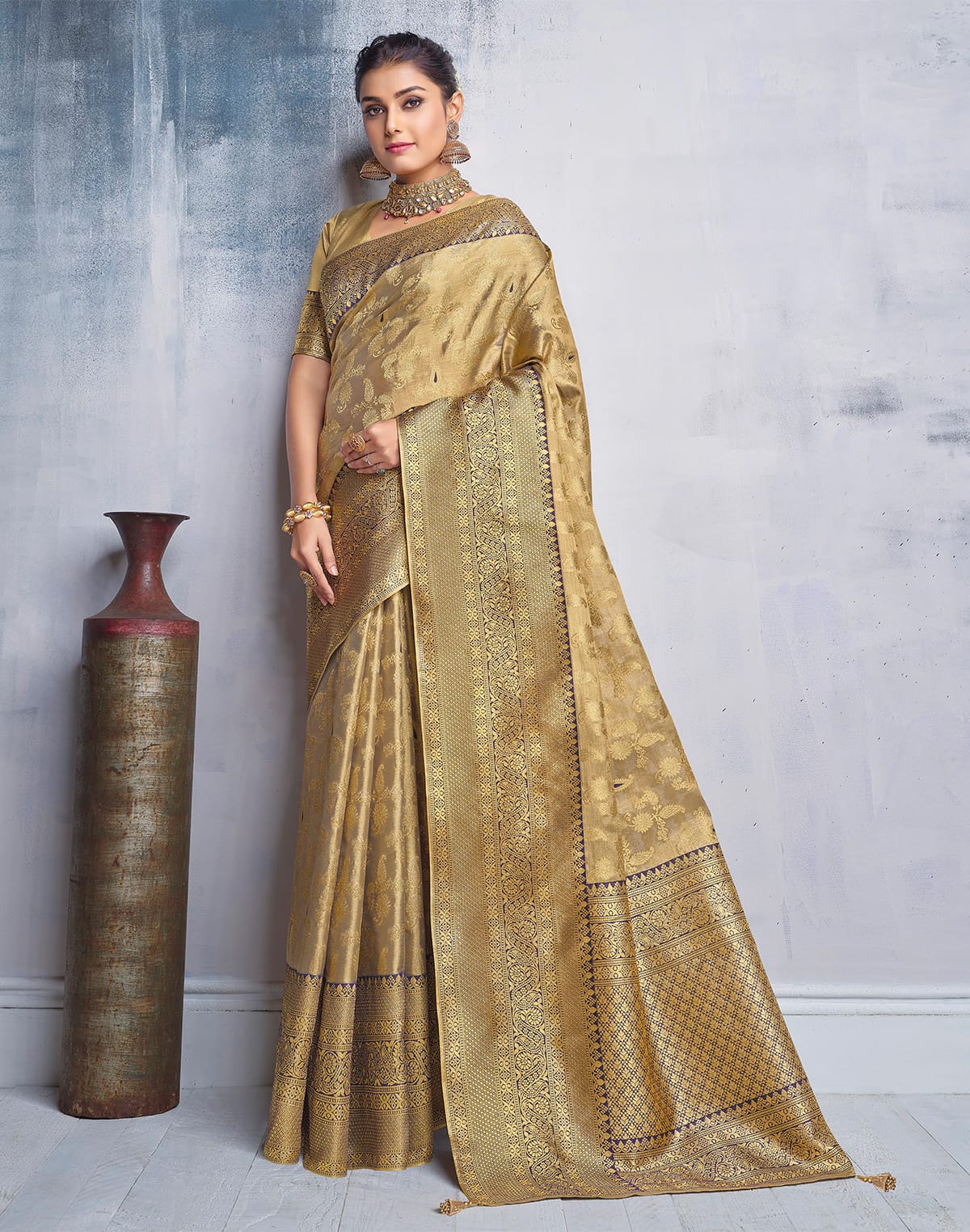 Collection of Gold Coloured all over Paisely design Banaras Tissue Saree in a gallery layout