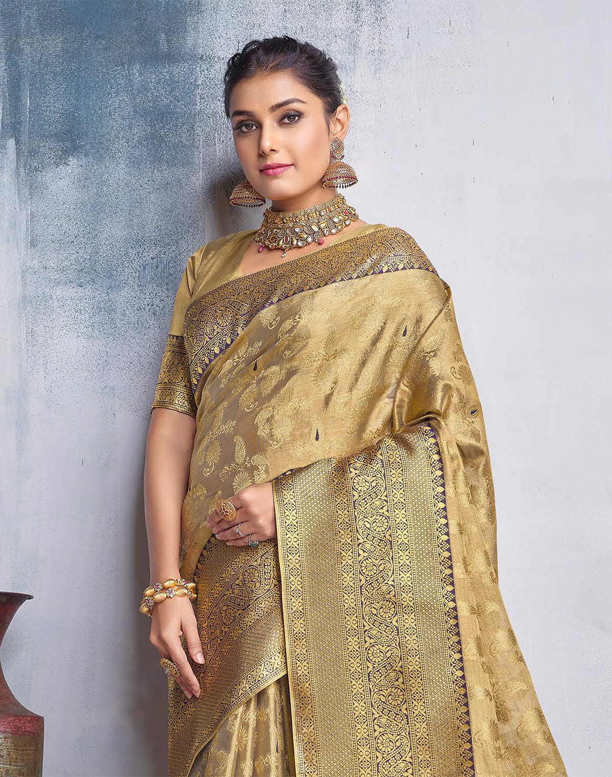 Collection of Gold Coloured all over Paisely design Banaras Tissue Saree in a gallery layout