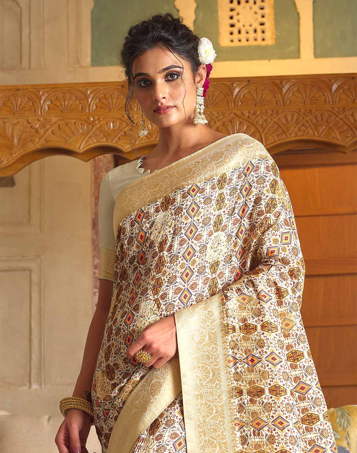 Collection of Soft Dola Silk Zari weaving Cream Saree in a gallery layout