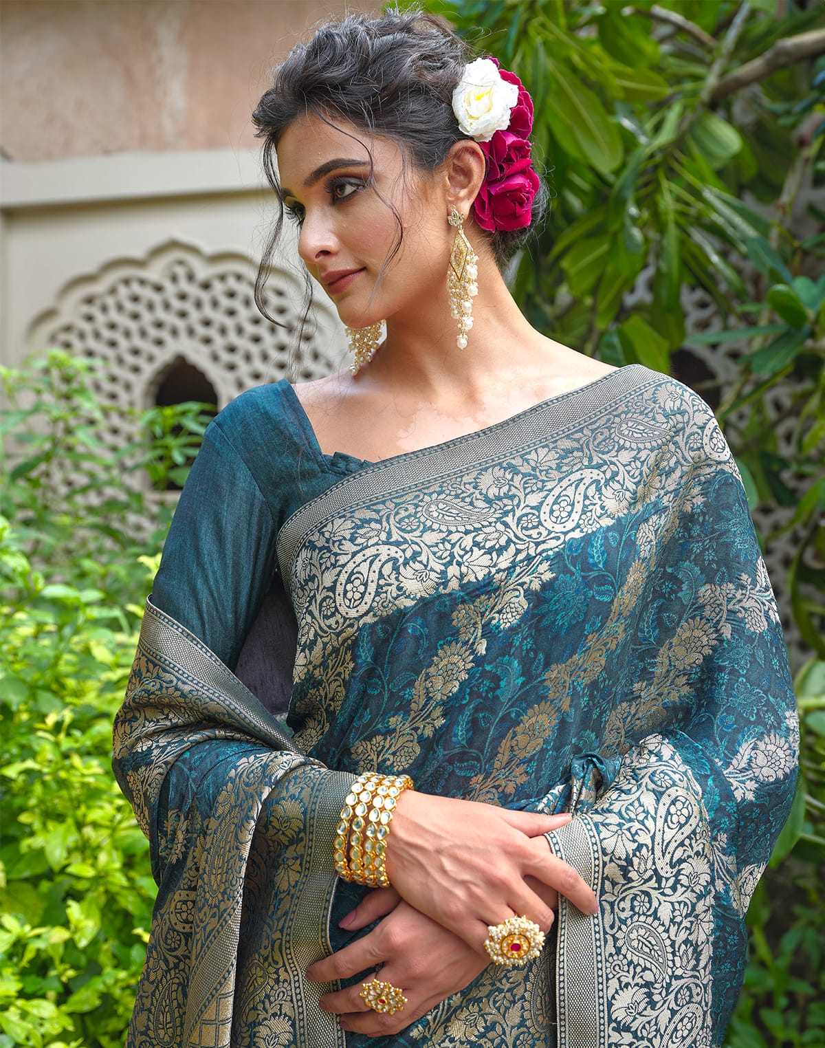 Collection of Peacock Blue Floral Dola Silk Designer Saree in a gallery layout