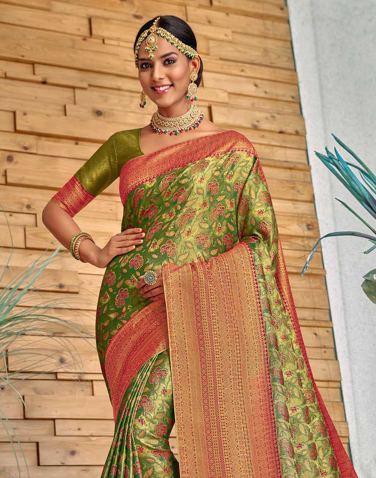 Collection of Green all over Floral Meena work Padiya Banaras Tissue Saree in a gallery layout