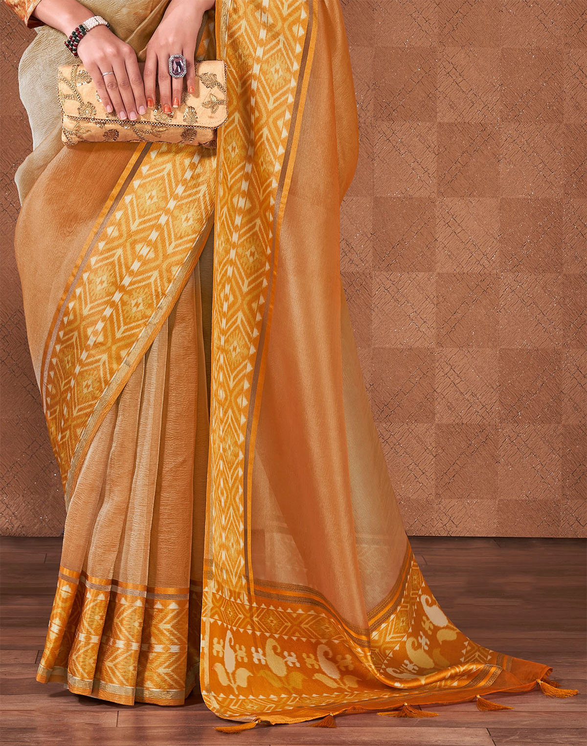 Collection of Orange and Grey Shaded Georgette Saree With Tussels in a gallery layout