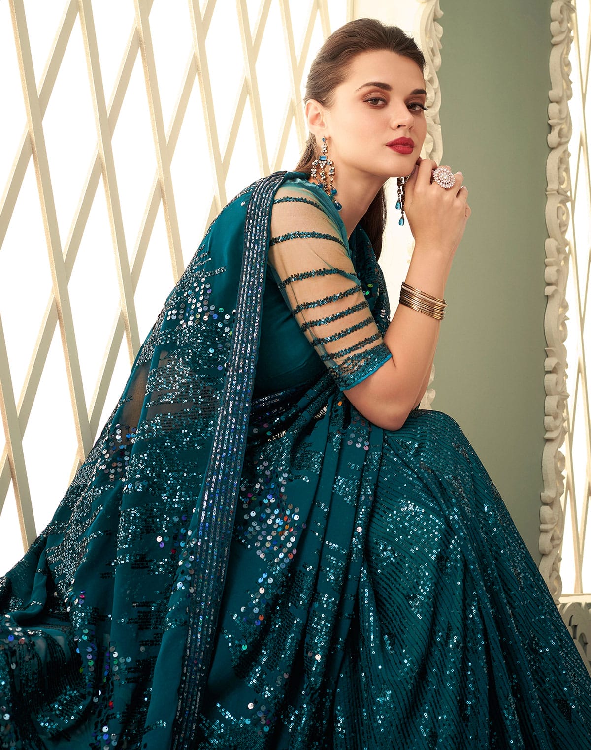 Collection of Peacock Blue Sequence work Georgette Saree in a gallery layout