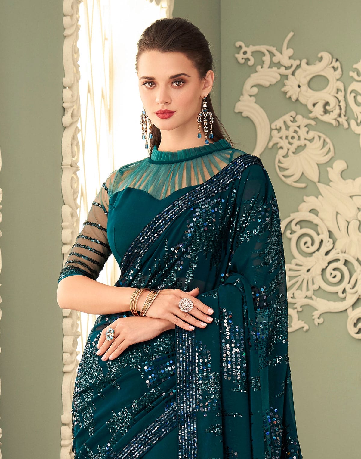 Collection of Peacock Blue Sequence work Georgette Saree in a gallery layout