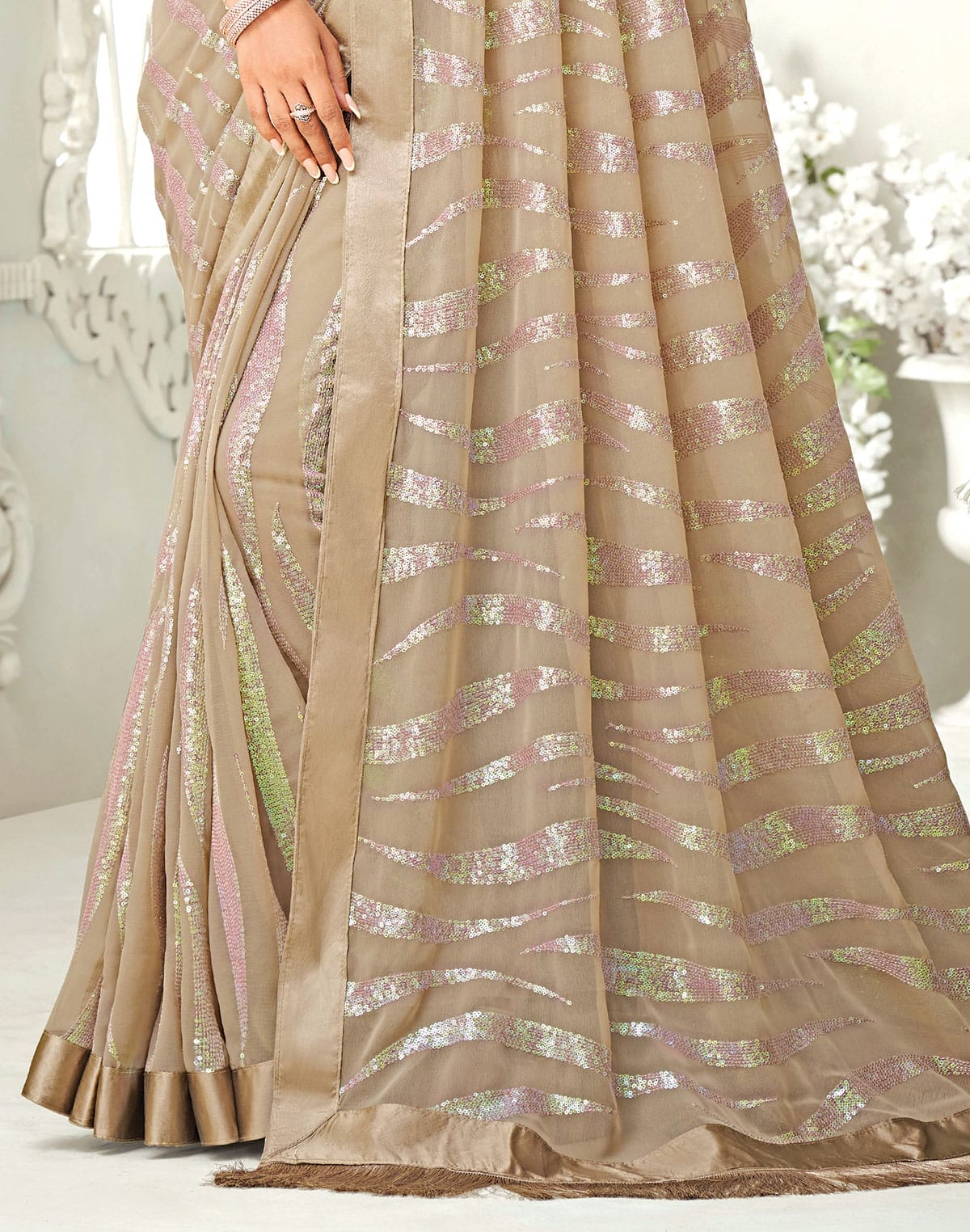 Collection of Sequence work Soft Georgette Light Brown Saree in a gallery layout