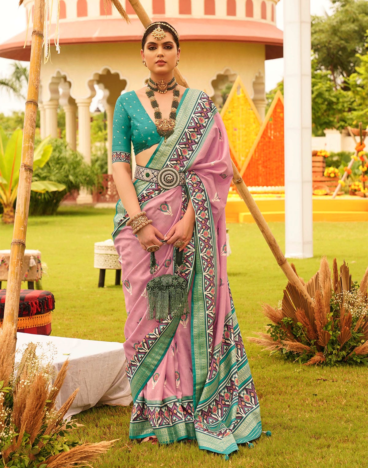 Collection of Charming Pink Patola Silk Designer Saree in a gallery layout