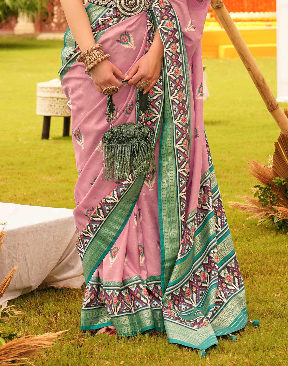 Collection of Charming Pink Patola Silk Designer Saree in a gallery layout