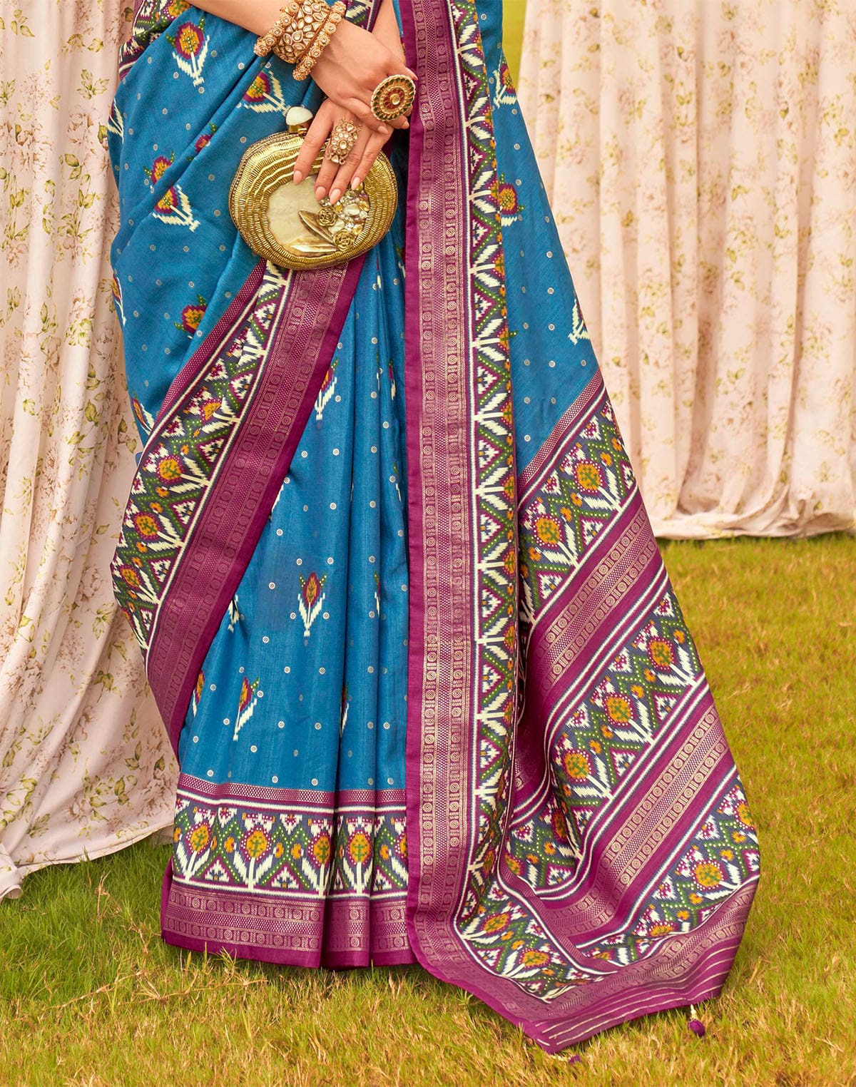 Collection of Captivating Blue Patola Silk Floral Festive Wear Saree in a gallery layout