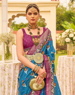 Collection of Captivating Blue Patola Silk Floral Festive Wear Saree in a gallery layout