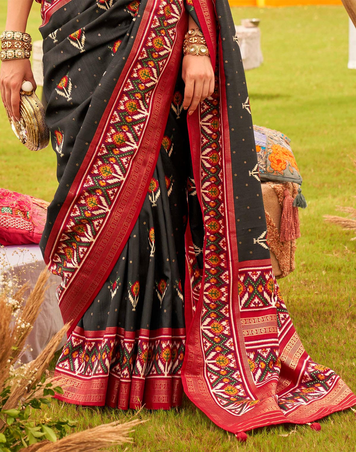 Collection of Alluring Black Patola Silk Floral Print Saree in a gallery layout