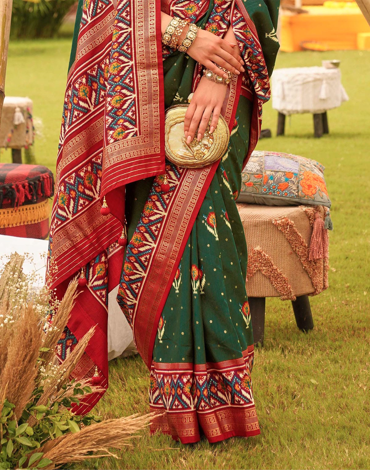 Collection of Dark Green Woven design Patola Silk Festive Saree in a gallery layout