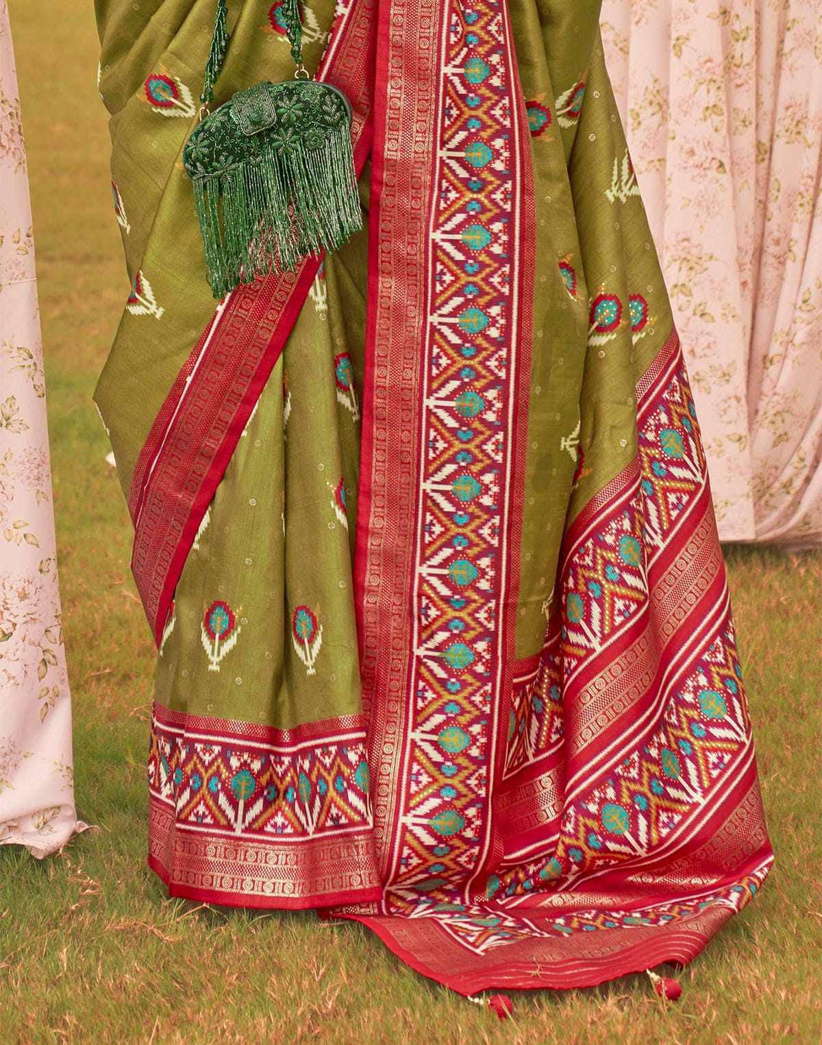 Collection of Stunning Mehendi Green Soft Patola Silk Saree in a gallery layout