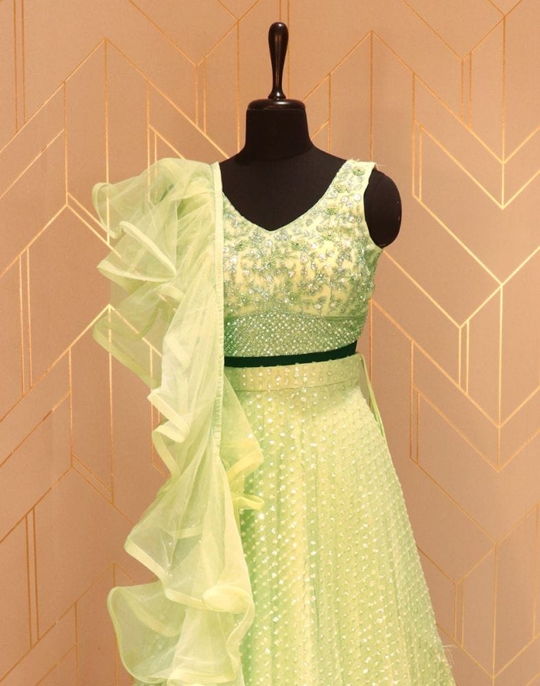 Collection of Pista Green Floral Embellished work Netted Crop Top and Lehenga Set in a gallery layout