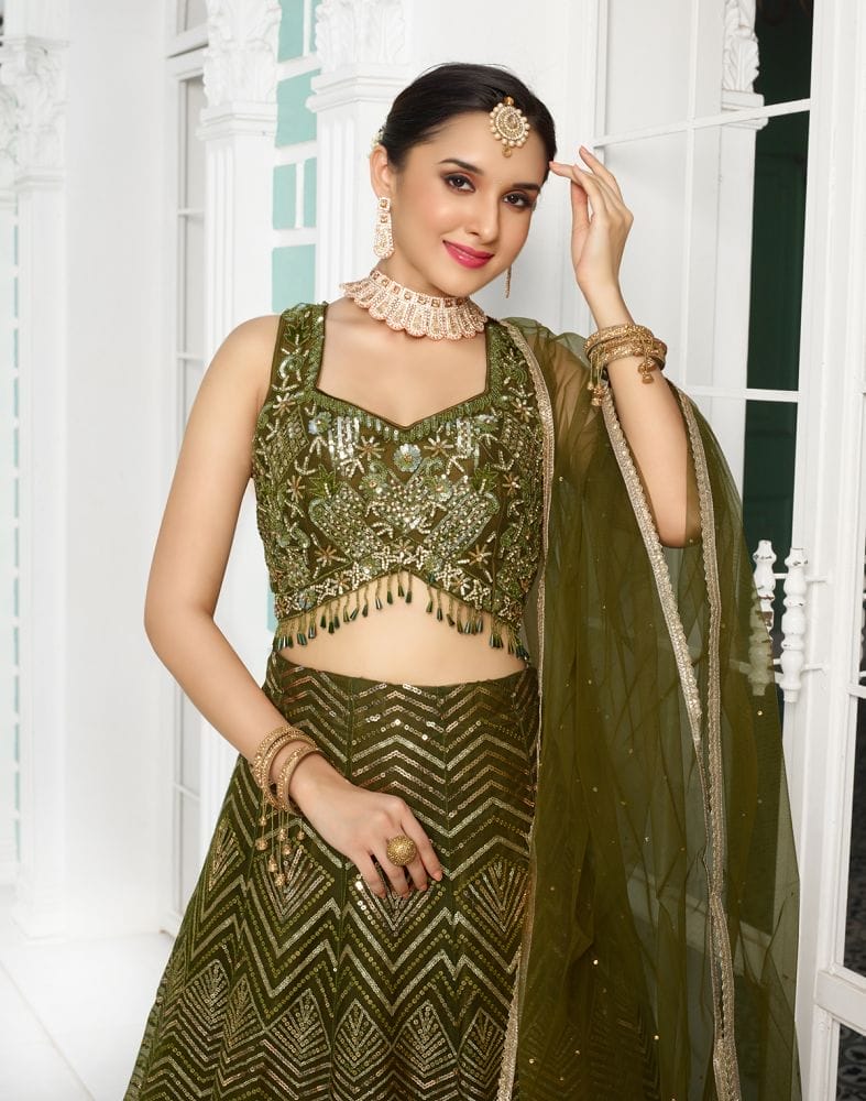 Collection of Designer Green Coloured Floral Netted Embellished work Crop Top and Lehenga Set in a gallery layout