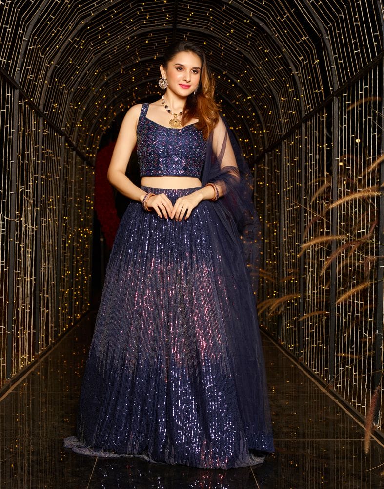 Collection of Designer Navy Blue Sequence Work Netted Crop Top and Lehenga Set in a gallery layout