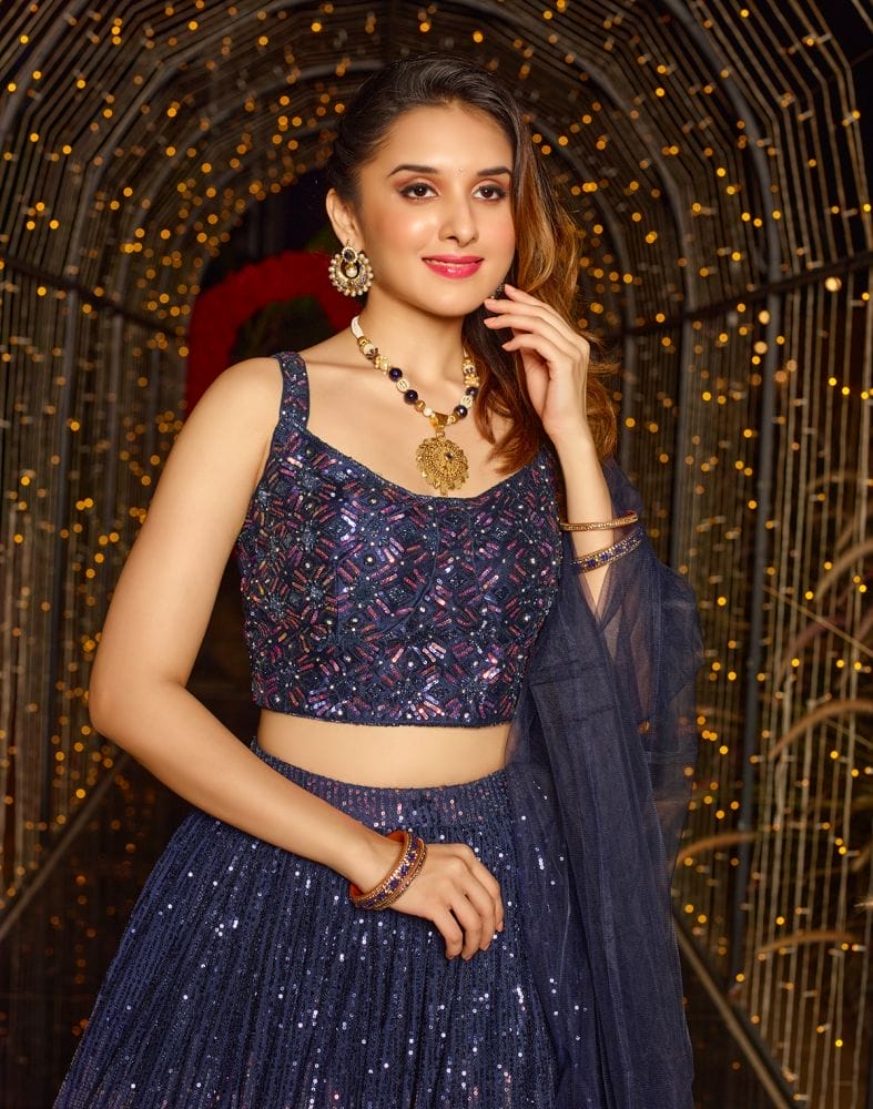 Collection of Designer Navy Blue Sequence Work Netted Crop Top and Lehenga Set in a gallery layout