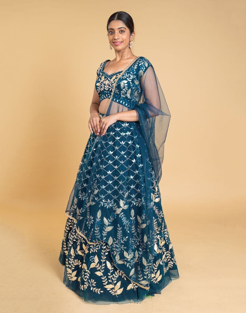 Collection of Designer Peacock Blue Floral Netted gotta patti Crop Top and lehenga set in a gallery layout