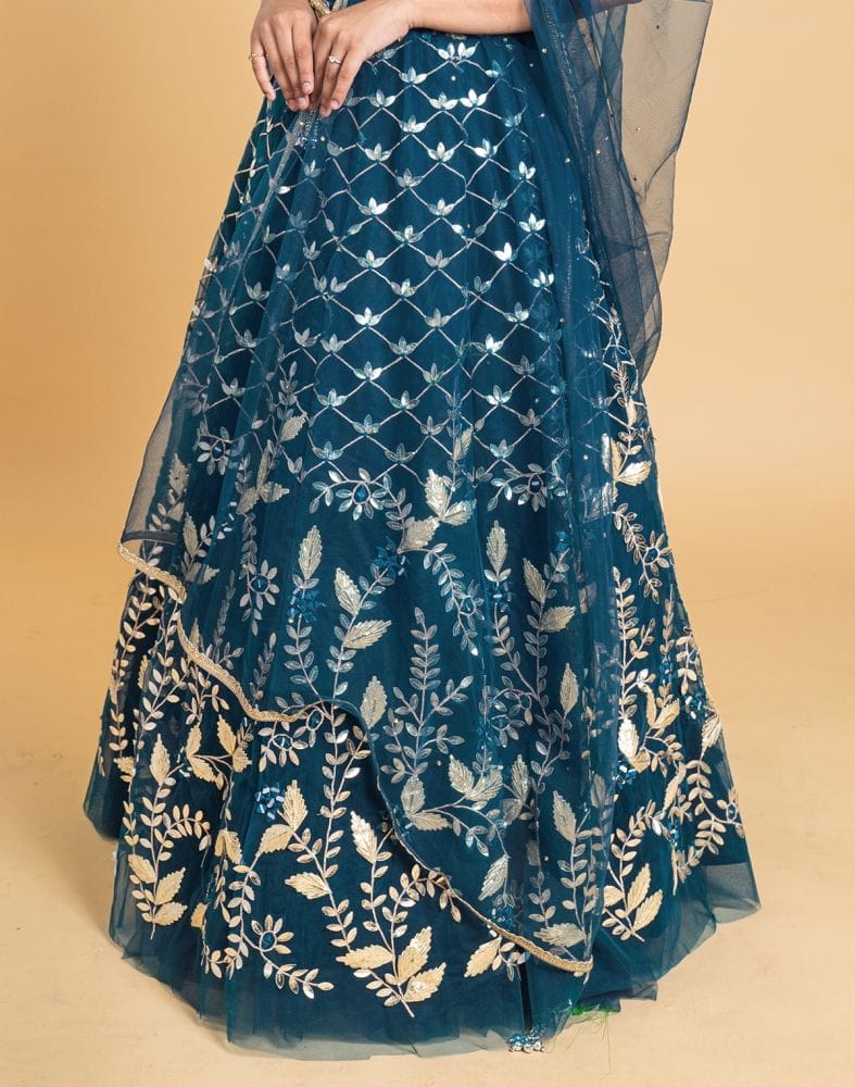 Collection of Designer Peacock Blue Floral Netted gotta patti Crop Top and lehenga set in a gallery layout