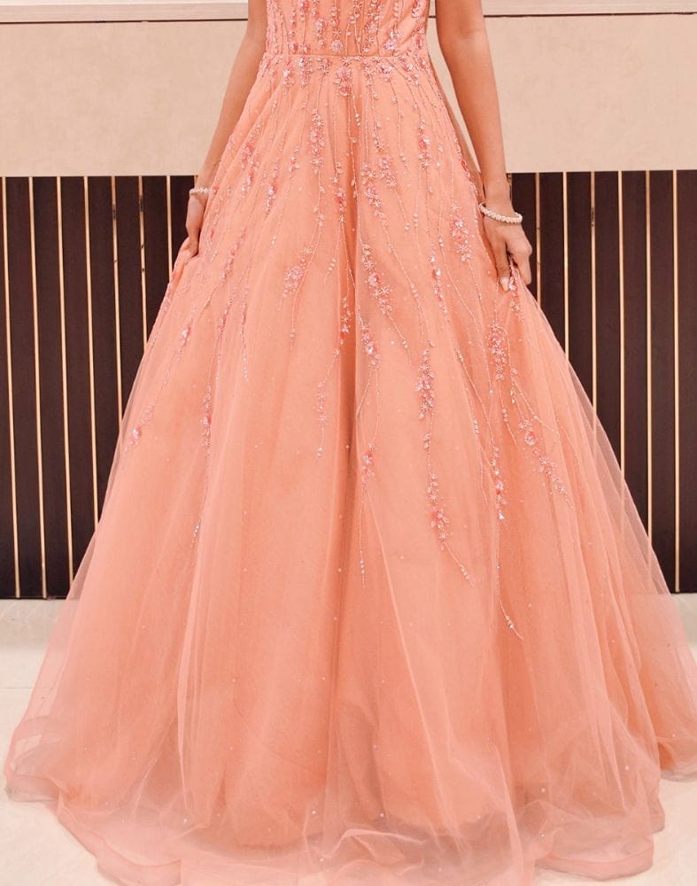 Collection of Peach fully flared Netted Embellished Gown in a gallery layout