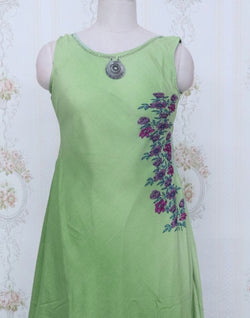 Collection of Light Green Floral Cotton Silk Stones work Kurti in a gallery layout