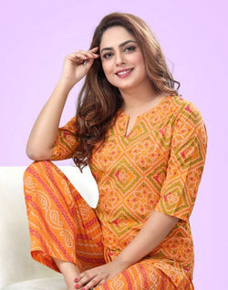 Collection of Orange Bandhini Cotton Printed Night Suit in a gallery layout