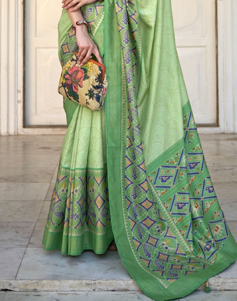 Collection of Parrot Green Bandhini Print Patola Saree in a gallery layout