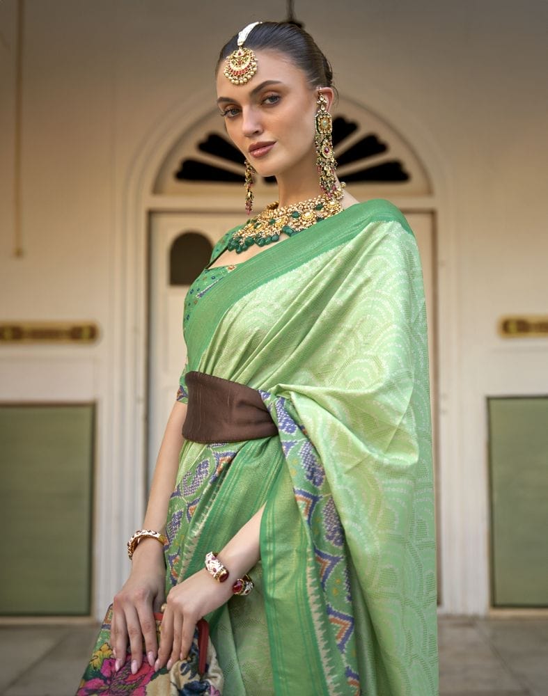 Collection of Parrot Green Bandhini Print Patola Saree in a gallery layout