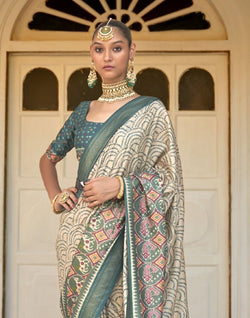 Collection of Bandhini Print Beige Coloured Patola Saree in a gallery layout