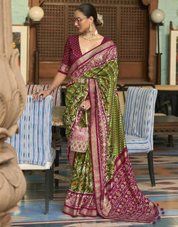 Collection of Green and Maroon Ikat Patola Printed Saree in a gallery layout