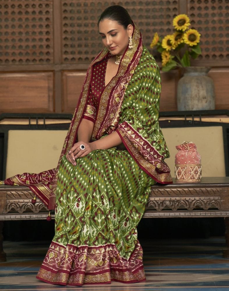 Collection of Green and Maroon Ikat Patola Printed Saree in a gallery layout