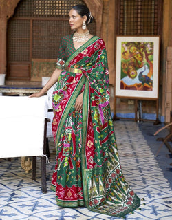 Collection of Stunning Green Coloured Ikat Patola Silk Saree in a gallery layout