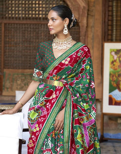 Collection of Stunning Green Coloured Ikat Patola Silk Saree in a gallery layout