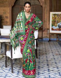 Collection of Stunning Green Coloured Ikat Patola Silk Saree in a gallery layout