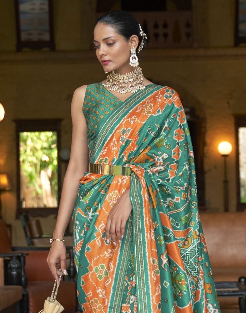 Collection of Admiral Green Ikat Patola Silk Fabric Saree in a gallery layout