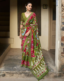 Collection of Stupendous Green Ikat Patola Saree in a gallery layout