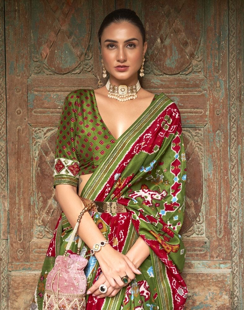 Collection of Stupendous Green Ikat Patola Saree in a gallery layout