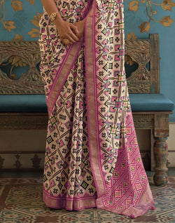 Collection of Cream Ikat Priyam Patola Saree in a gallery layout