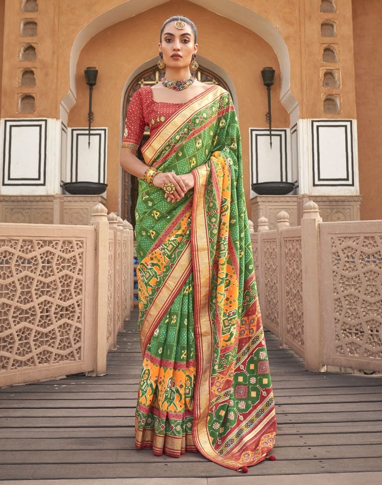 Collection of Green Ikat Pattern Mirror work Patola Saree in a gallery layout