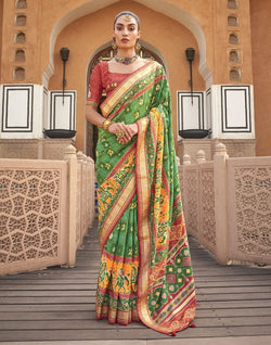 Collection of Green Ikat Pattern Mirror work Patola Saree in a gallery layout