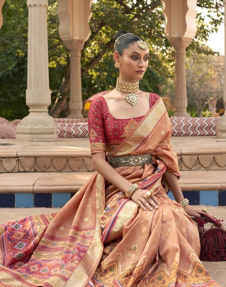 Collection of Exclusive Orange Geometric Print Patola Fabric Saree in a gallery layout