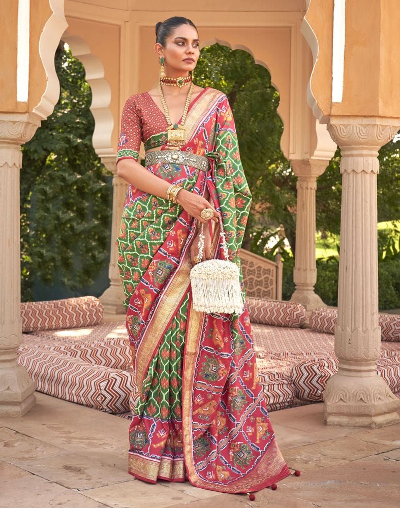 Collection of Beautiful Green Coloured Ikat Print Patola Saree in a gallery layout