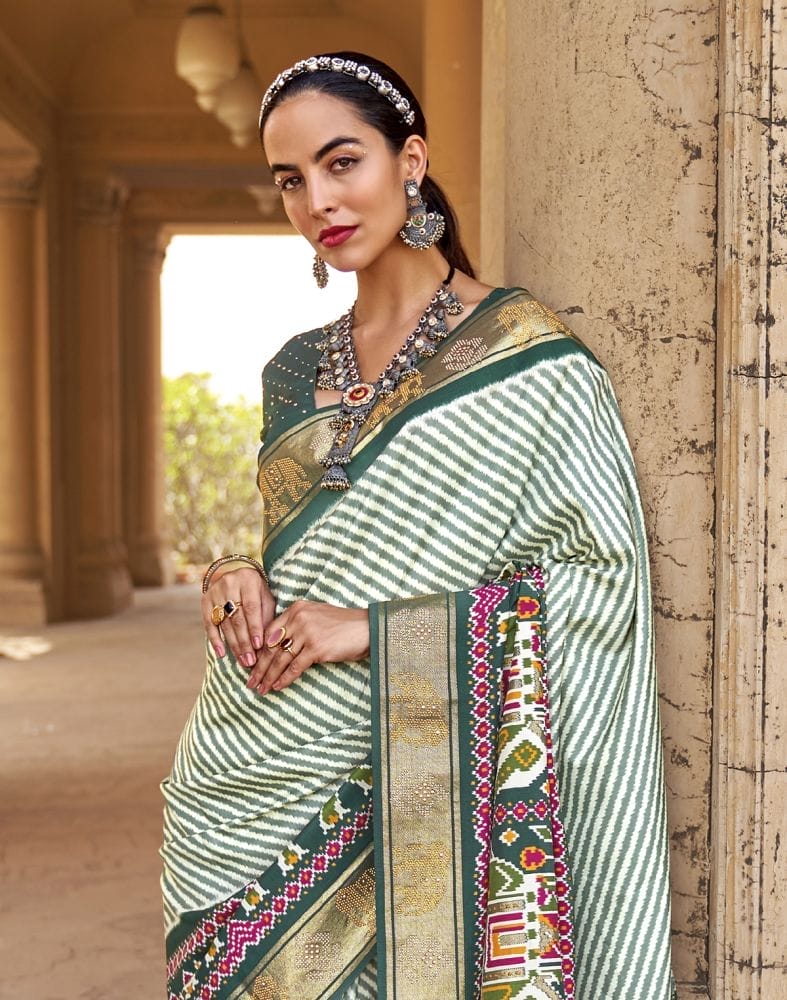 Collection of Green Stripes Soft Patola Fabric Saree in a gallery layout