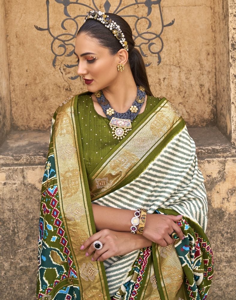 Collection of Light Green Striped Pattern Patola Silk Saree in a gallery layout