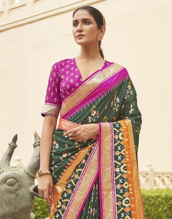 Collection of Gorgeous Dark Green Floral Patola Saree in a gallery layout